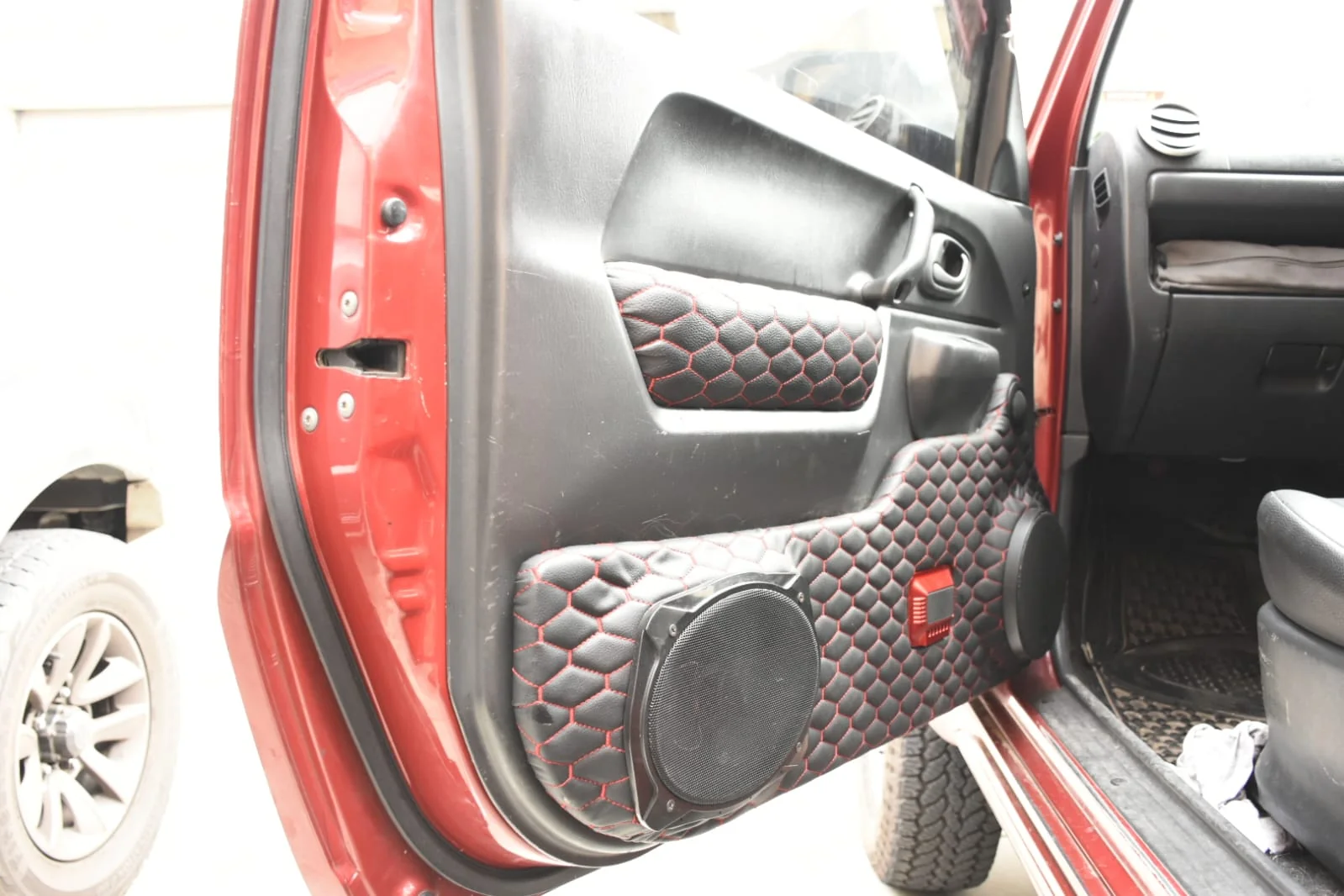 Close-up detail of custom car audio speakers and grilles